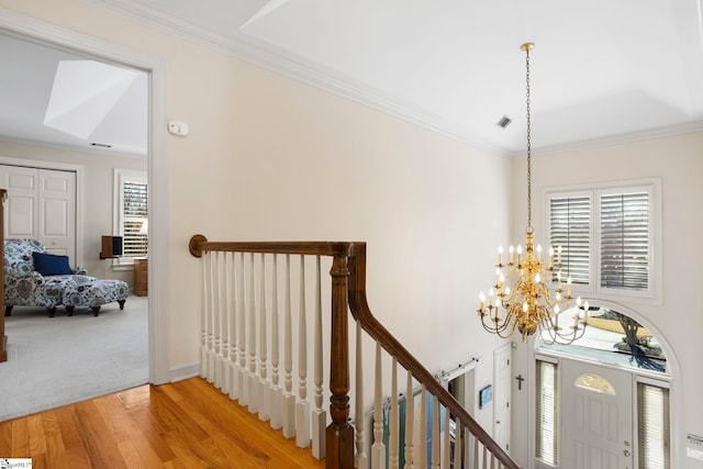 204 Waterford Ln, Greer, SC 29650 - hallway featuring a chandelier, ornamental molding, visible vents, and an upstairs landing