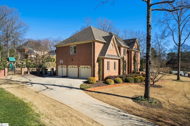 view of side of home featuring brick siding, a playground, a shingled roof, concrete driveway, and a garage