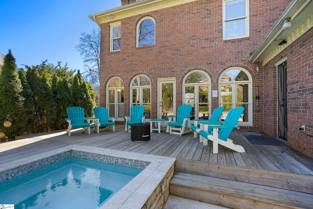 204 Waterford Ln, Greer, SC 29650 - back of house featuring brick siding, a jacuzzi, and a deck