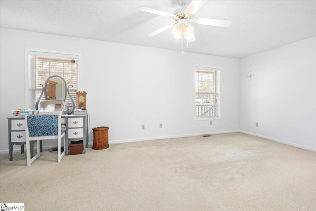 bedroom featuring carpet flooring, ceiling fan, a textured ceiling, and baseboards