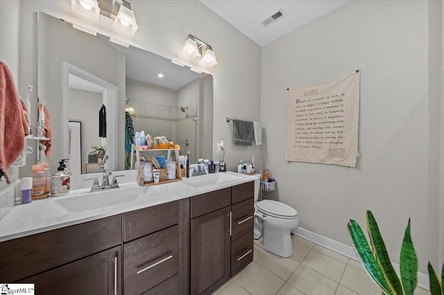 bathroom with tile patterned flooring, visible vents, a sink, and a shower stall