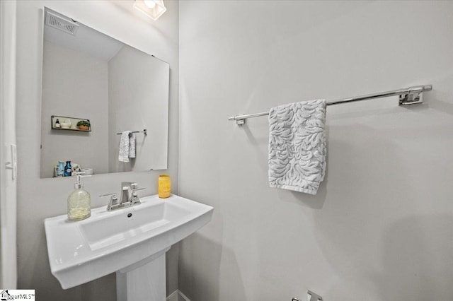 bathroom featuring a sink and visible vents