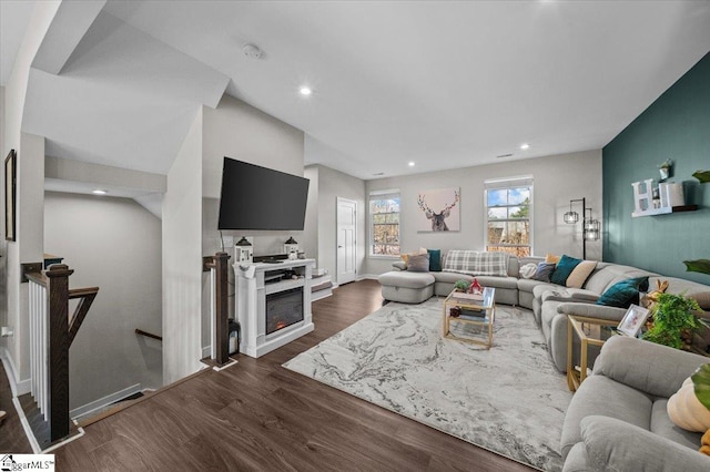 living room featuring dark wood-style flooring and recessed lighting