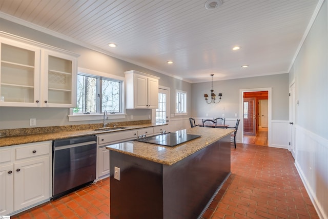 kitchen with black electric stovetop, brick floor, a sink, ornamental molding, and dishwasher