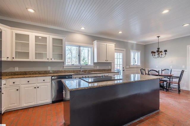 kitchen with brick floor, recessed lighting, ornamental molding, a sink, and dishwasher