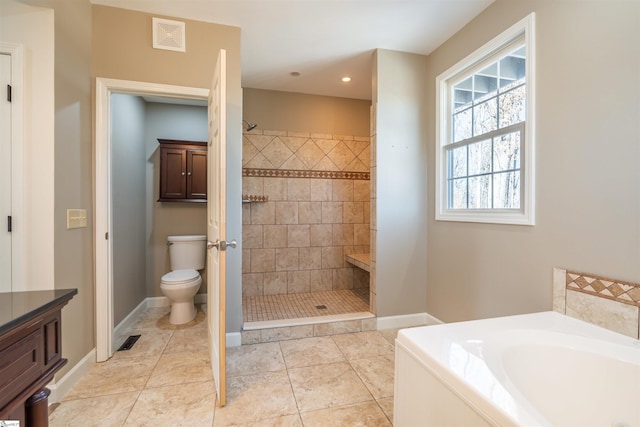 full bathroom featuring visible vents, toilet, a tile shower, a bath, and tile patterned floors