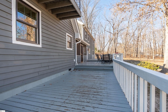 wooden deck with outdoor dining space