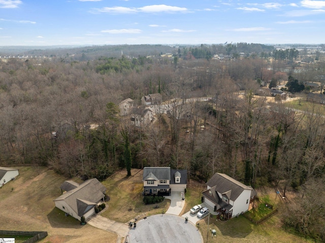 bird's eye view featuring a forest view