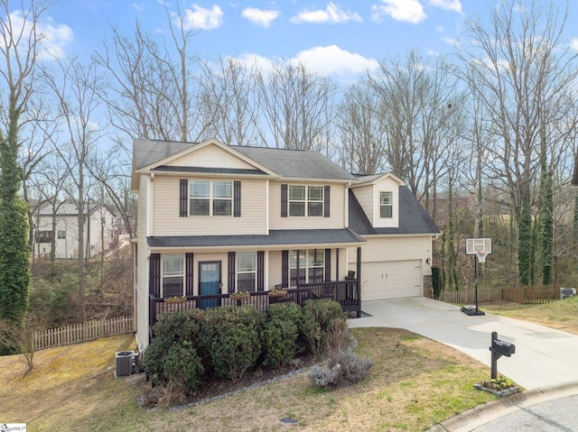 traditional-style house with a garage, concrete driveway, covered porch, fence, and cooling unit