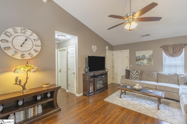 living room with baseboards, visible vents, ceiling fan, wood finished floors, and high vaulted ceiling