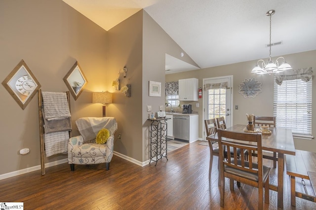 dining space featuring high vaulted ceiling, baseboards, a chandelier, and wood finished floors