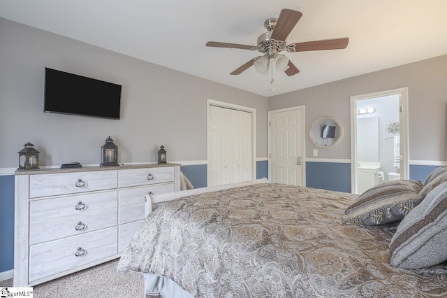 carpeted bedroom featuring a ceiling fan, a closet, and connected bathroom