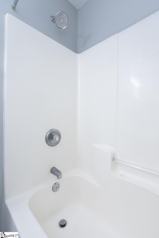 full bath featuring bathing tub / shower combination