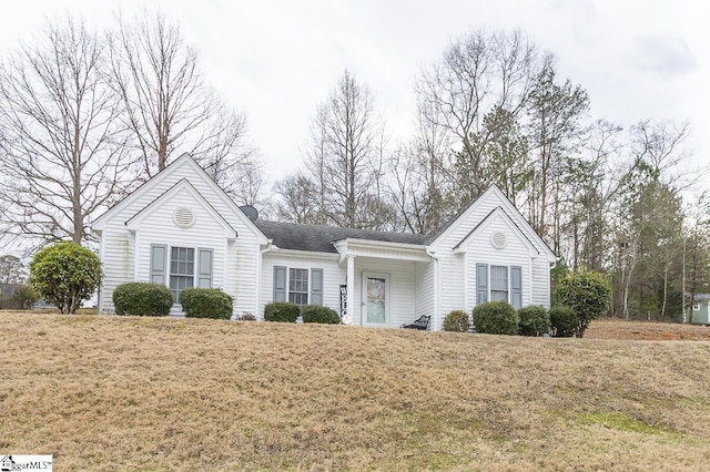 single story home with a front lawn