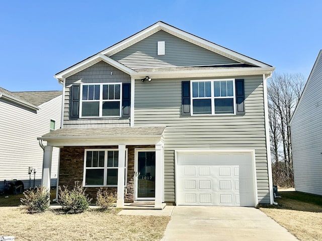 view of front of property featuring an attached garage, driveway, and a porch