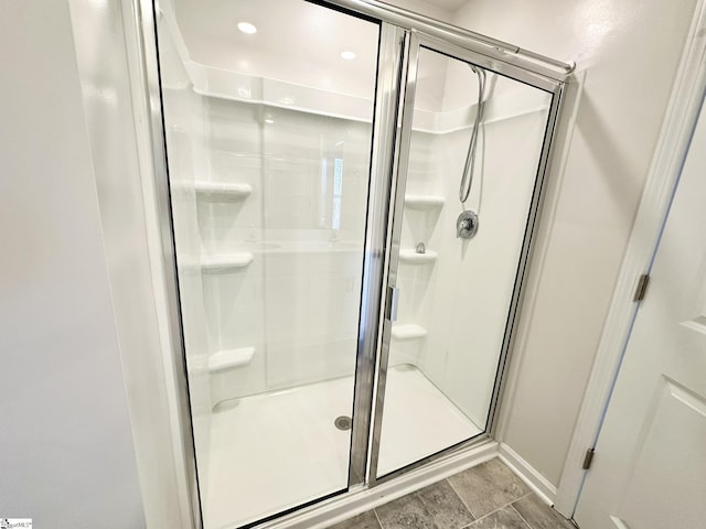 full bath featuring a stall shower and recessed lighting