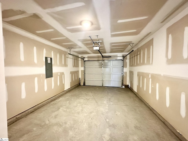 garage featuring a garage door opener and electric panel