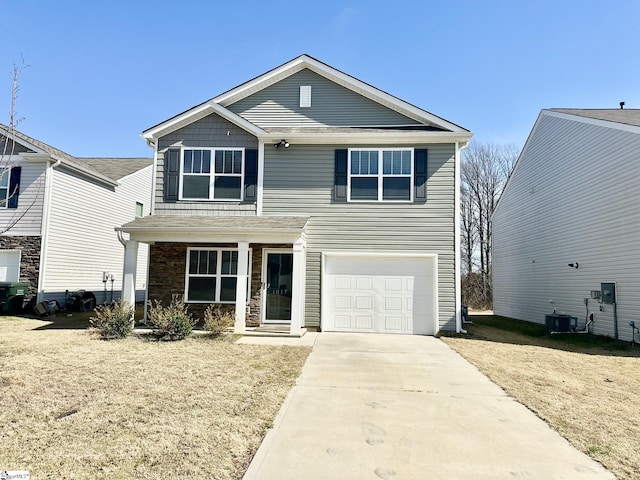 traditional home with driveway, a garage, a porch, and cooling unit