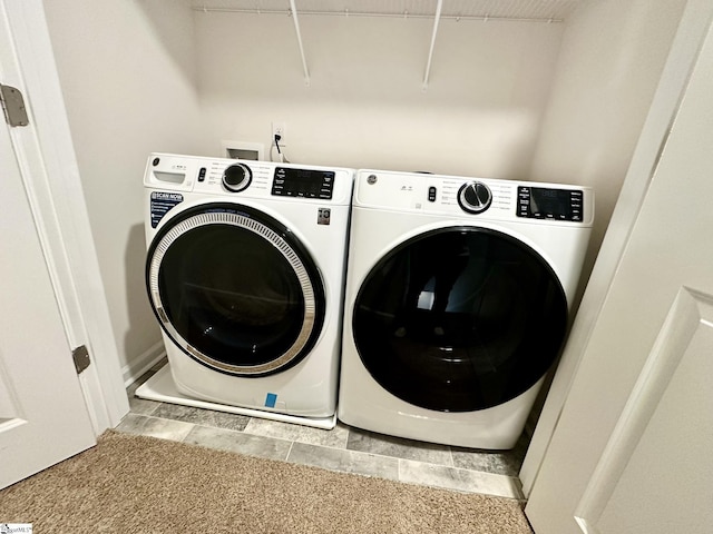 washroom with laundry area and washer and clothes dryer