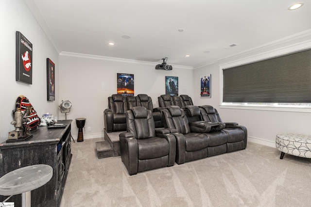 cinema room featuring light carpet, baseboards, and ornamental molding