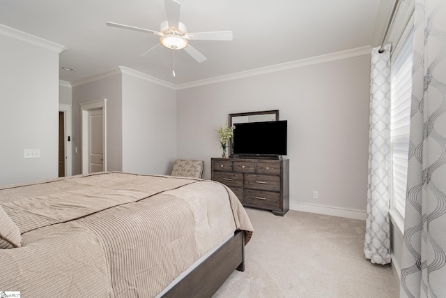 bedroom featuring light carpet, ornamental molding, a ceiling fan, and baseboards