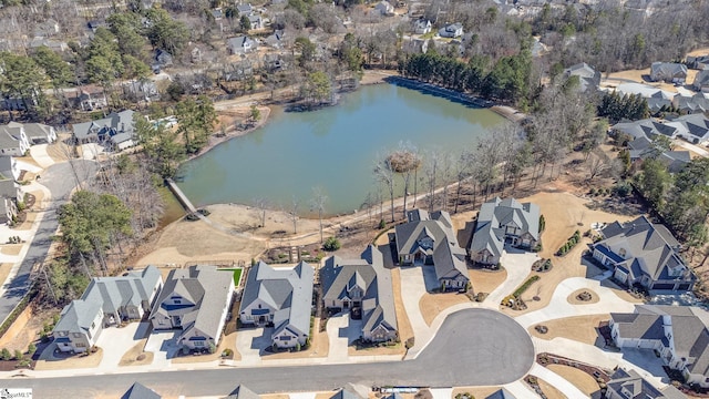 birds eye view of property featuring a water view and a residential view