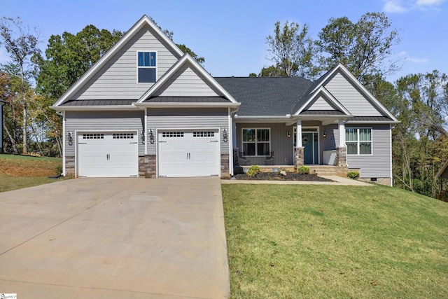 craftsman-style home featuring a standing seam roof, metal roof, concrete driveway, and a front yard