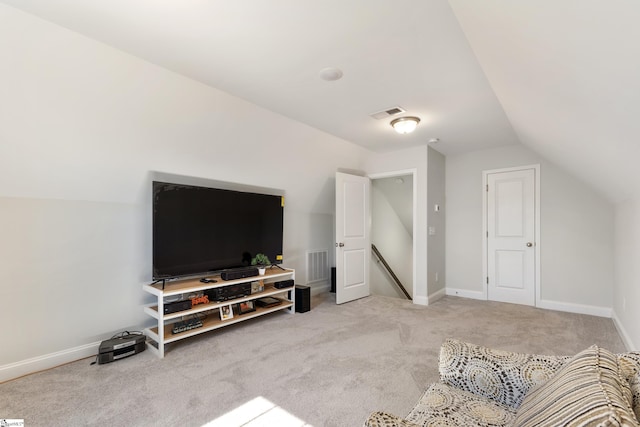 interior space with lofted ceiling, visible vents, and baseboards