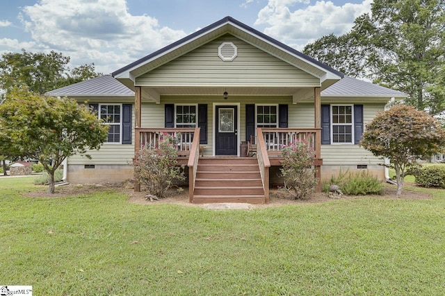 view of front of house with metal roof, a porch, crawl space, and a front yard