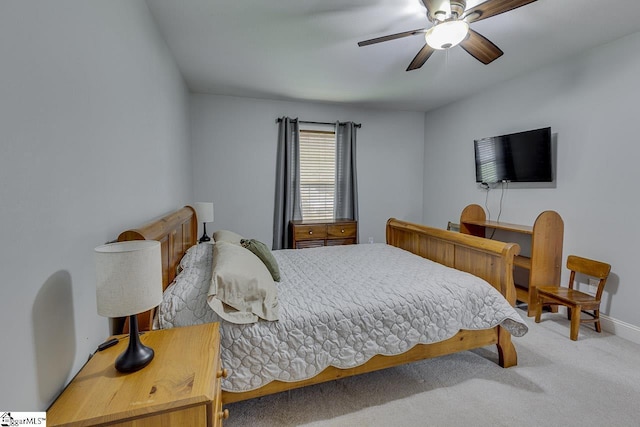 bedroom featuring carpet, baseboards, and a ceiling fan