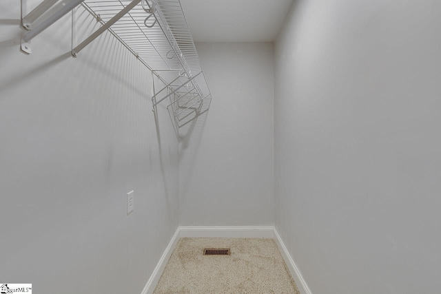 walk in closet with visible vents