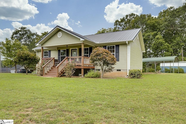 view of front of home with crawl space, metal roof, a porch, and a front lawn