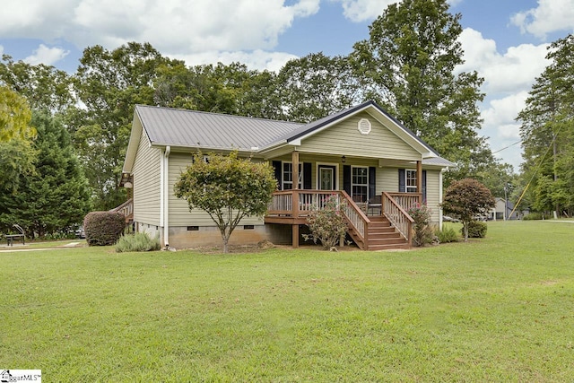 ranch-style house with covered porch, metal roof, a front lawn, and crawl space