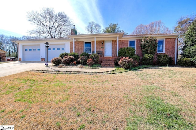 ranch-style house with a garage, brick siding, a chimney, and a front lawn