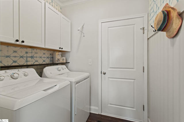 clothes washing area featuring cabinet space and independent washer and dryer