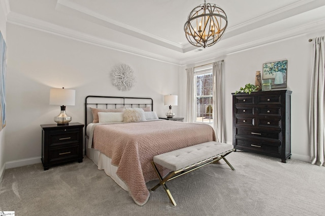 bedroom with baseboards, light colored carpet, a tray ceiling, crown molding, and a chandelier