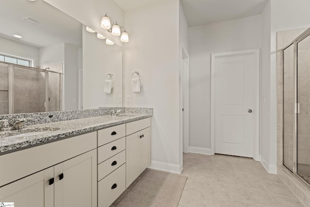 full bath featuring double vanity, a stall shower, a sink, and visible vents