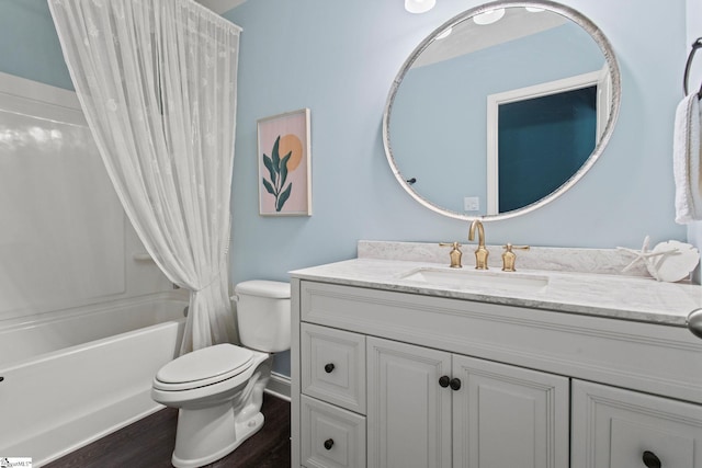 bathroom featuring baseboards, toilet, wood finished floors, shower / bathtub combination with curtain, and vanity