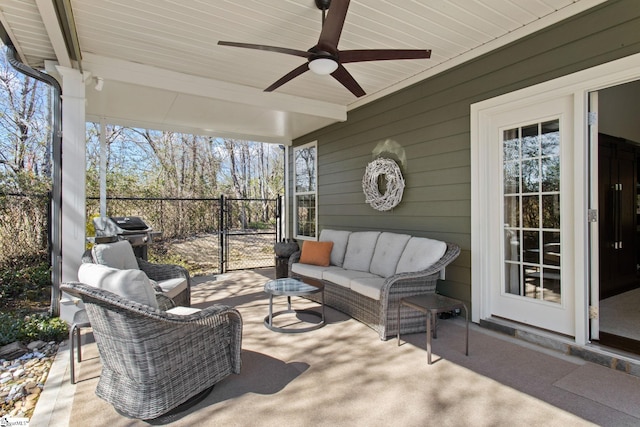 exterior space with ceiling fan and beam ceiling