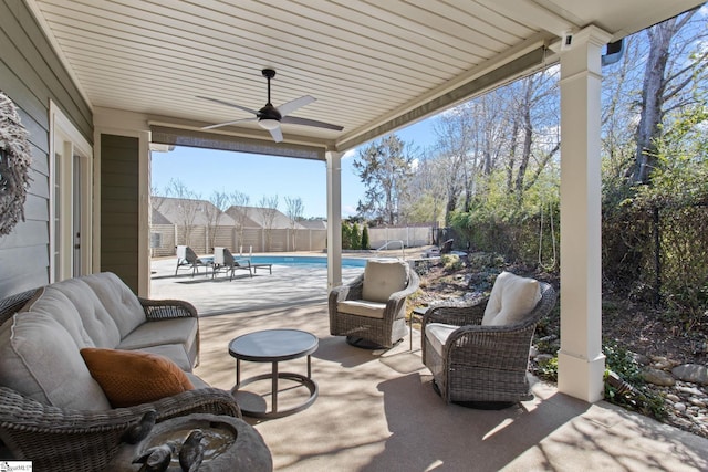 view of patio / terrace featuring a ceiling fan, a fenced in pool, a fenced backyard, and an outdoor living space