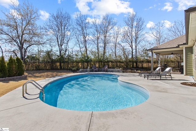 view of pool featuring a patio area, a fenced backyard, and a fenced in pool