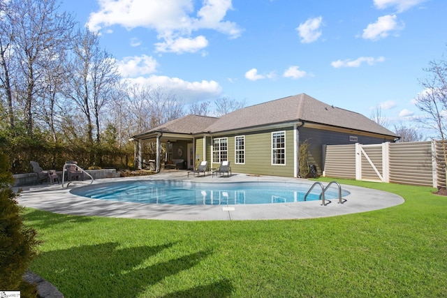 view of pool with a lawn, a patio area, fence, and a fenced in pool