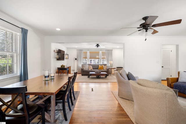 dining area with ornamental molding, recessed lighting, a ceiling fan, and light wood-style floors