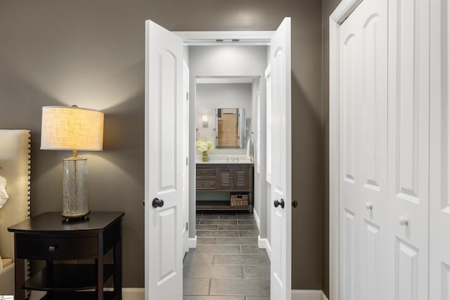 hall featuring a sink