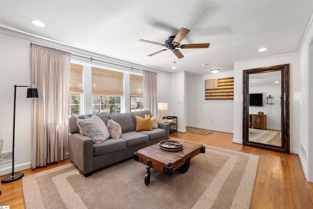 living area featuring light wood finished floors, recessed lighting, and baseboards