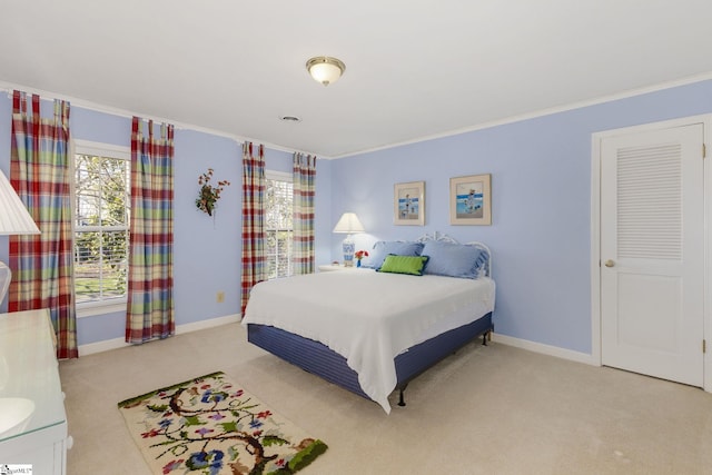 bedroom featuring carpet floors, multiple windows, and baseboards