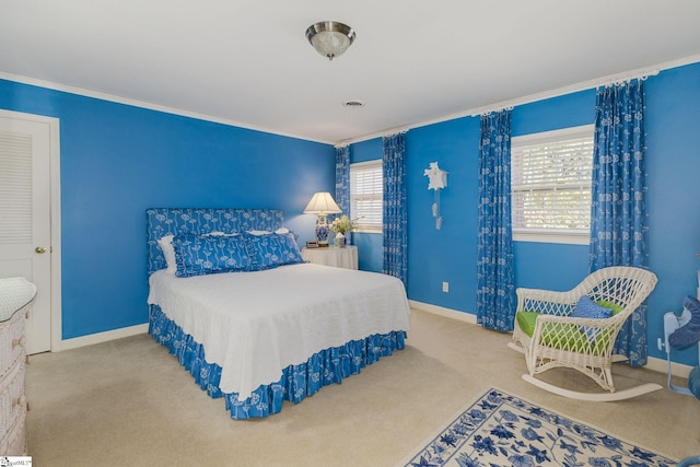 bedroom with ornamental molding, carpet flooring, visible vents, and baseboards