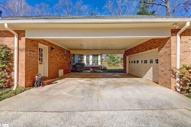 view of parking featuring a garage, entry steps, and concrete driveway