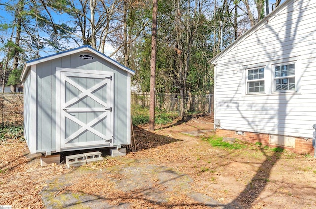 view of shed with fence