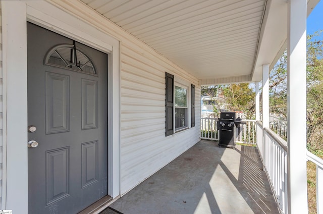 balcony featuring a porch and grilling area